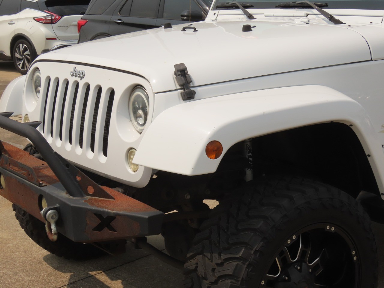 2014 Jeep Wrangler Unlimited Sahara Bright White Clearcoat at Planet Ford