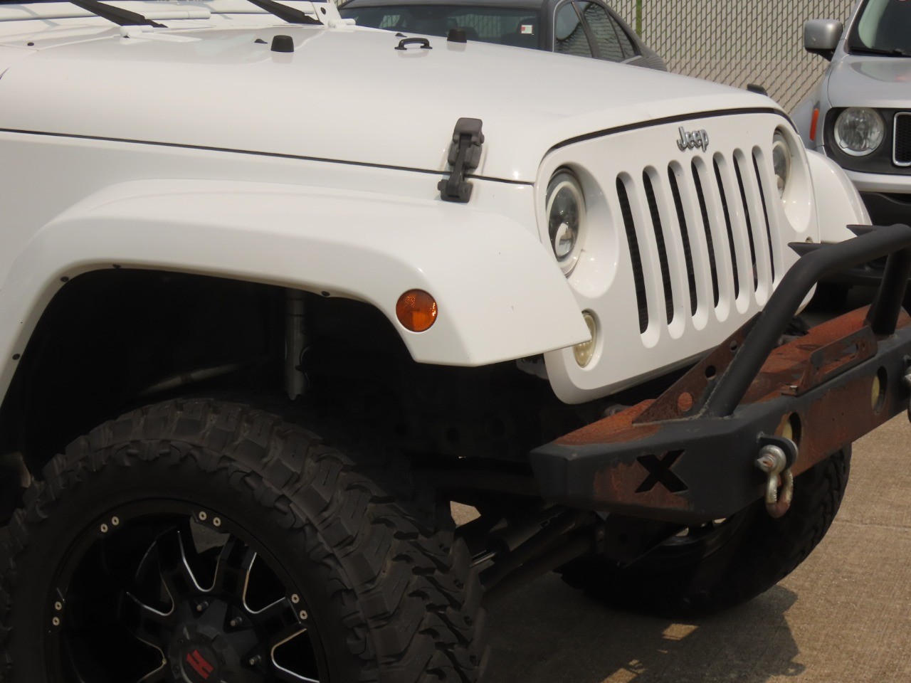 2014 Jeep Wrangler Unlimited Sahara Bright White Clearcoat at Planet Ford