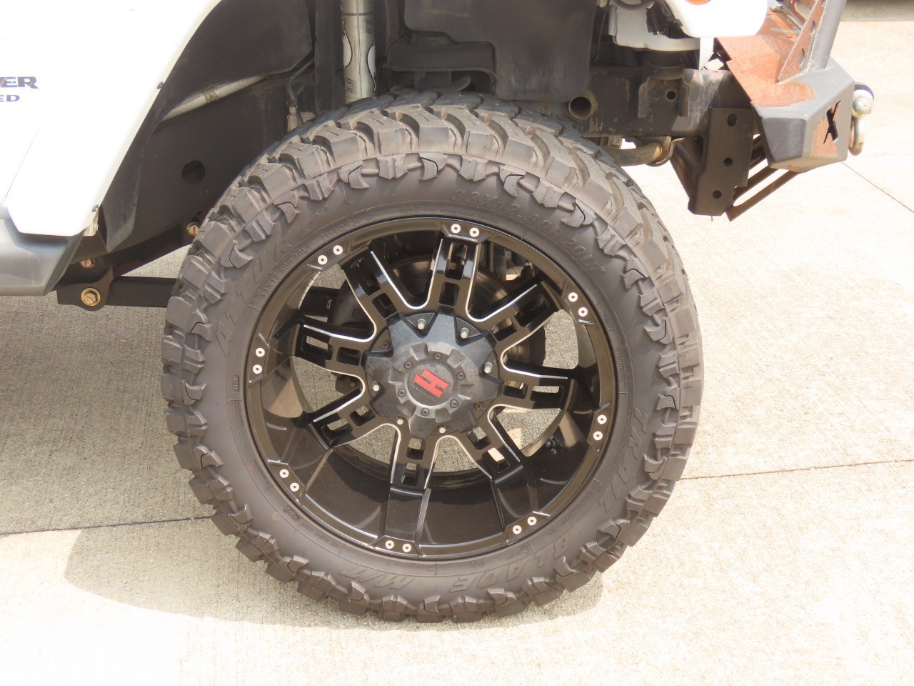 2014 Jeep Wrangler Unlimited Sahara Bright White Clearcoat at Planet Ford