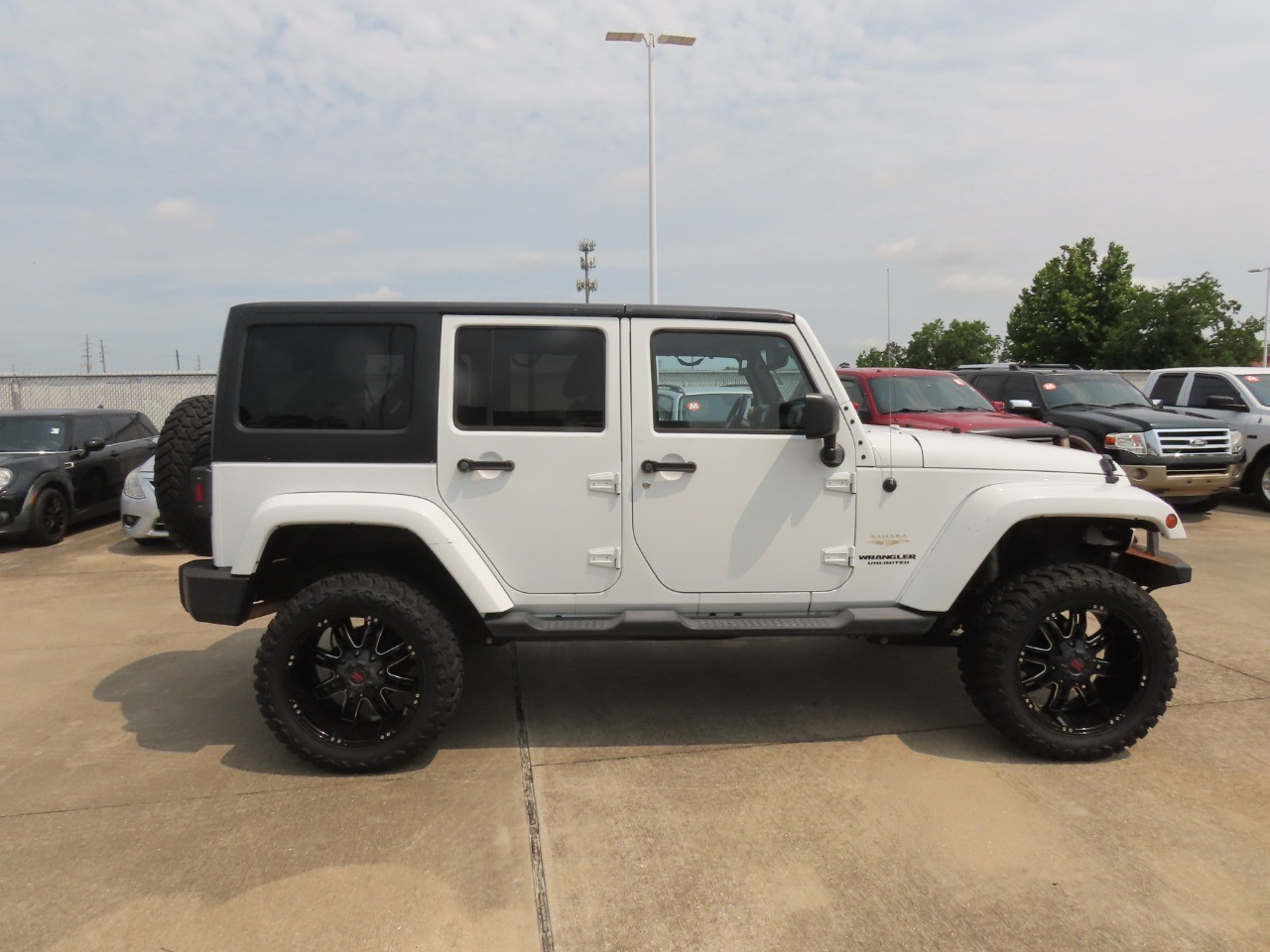 2014 Jeep Wrangler Unlimited Sahara Bright White Clearcoat at Planet Ford