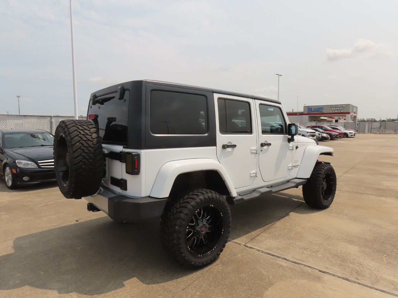 2014 Jeep Wrangler Unlimited Sahara Bright White Clearcoat at Planet Ford