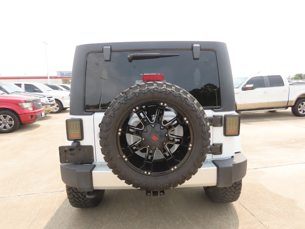 2014 Jeep Wrangler Unlimited Sahara Bright White Clearcoat at Planet Ford
