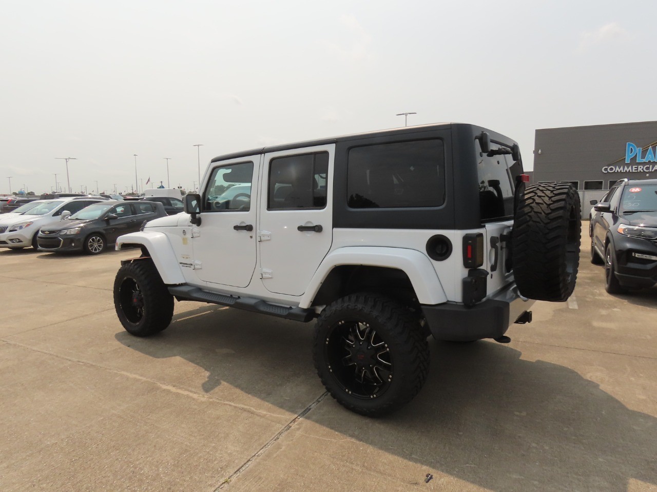 2014 Jeep Wrangler Unlimited Sahara Bright White Clearcoat at Planet Ford