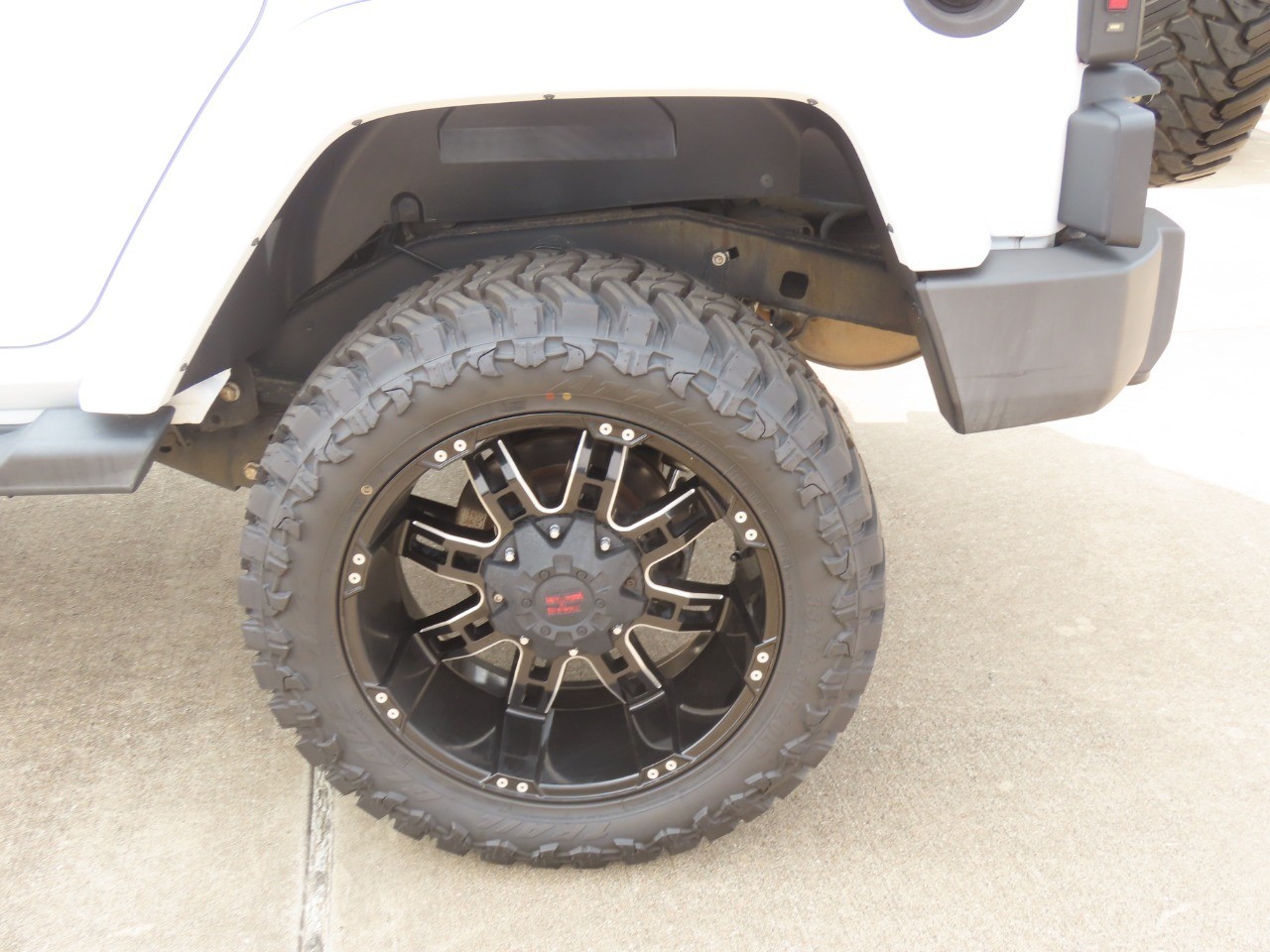 2014 Jeep Wrangler Unlimited Sahara Bright White Clearcoat at Planet Ford