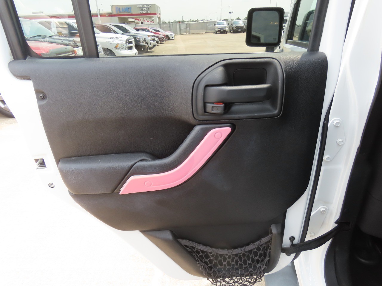2014 Jeep Wrangler Unlimited Sahara Bright White Clearcoat at Planet Ford