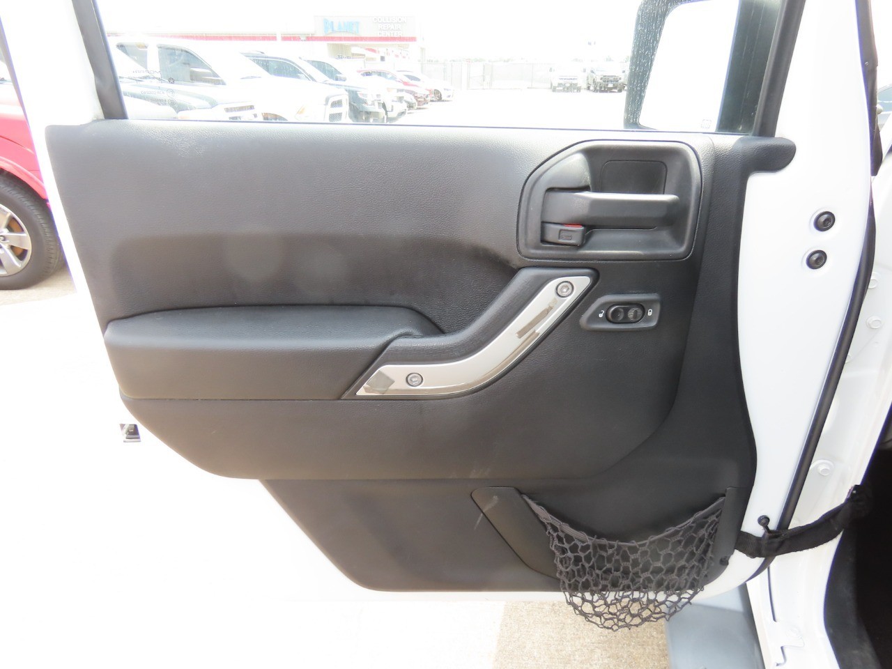 2014 Jeep Wrangler Unlimited Sahara Bright White Clearcoat at Planet Ford