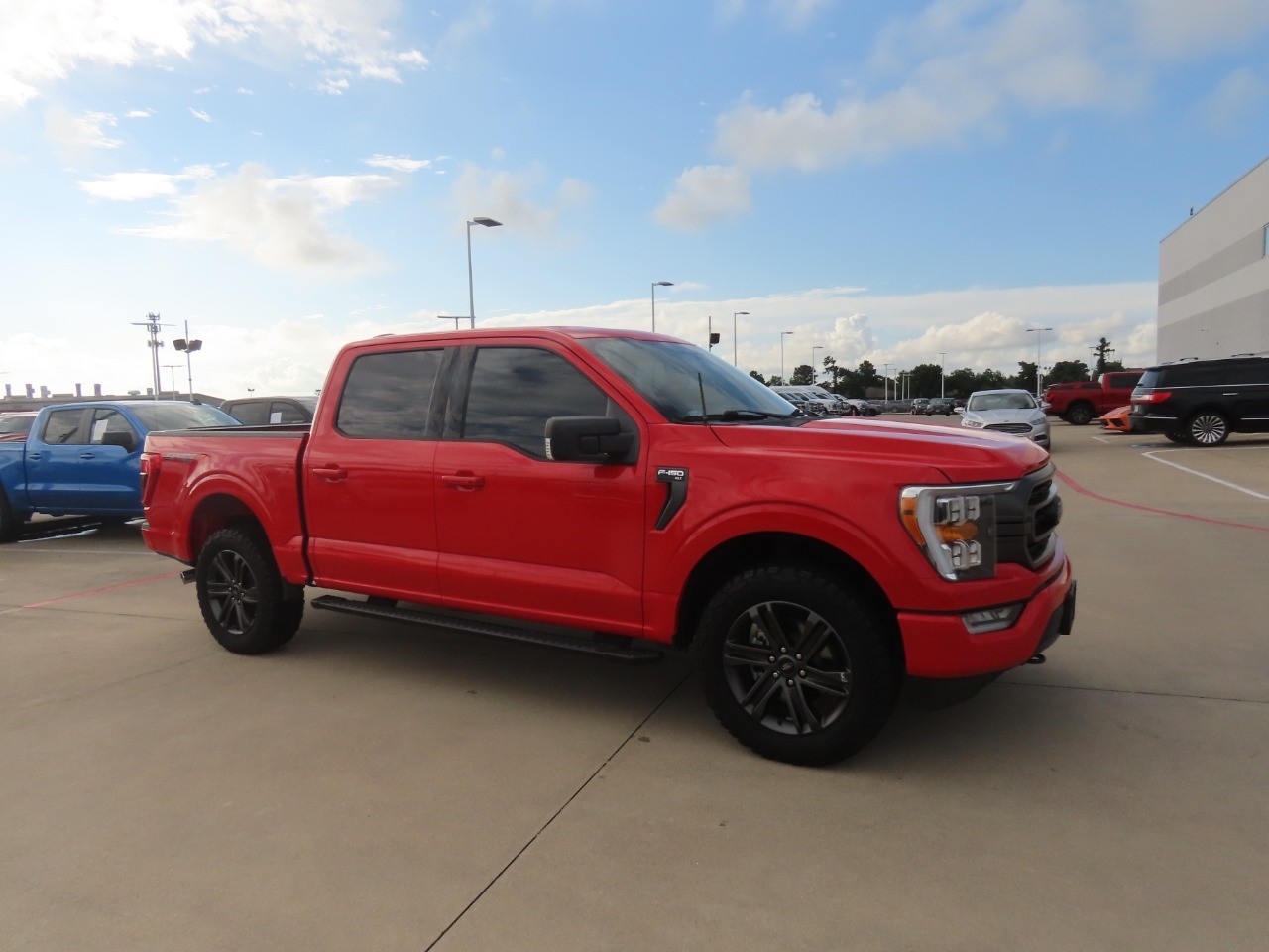 2022 Ford F-150 LARIAT Race Red at Planet Ford