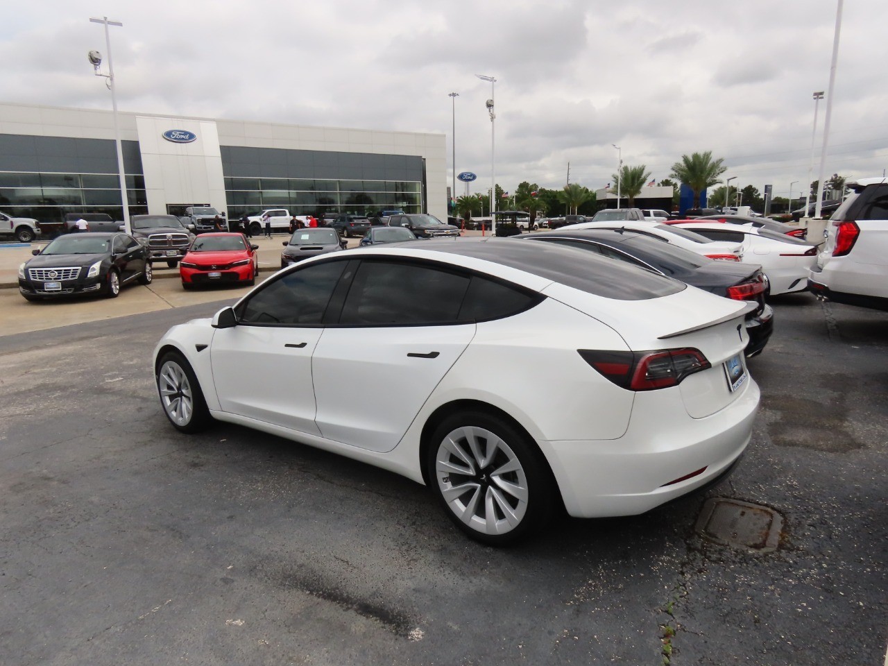 used 2023 Tesla Model 3 car, priced at $26,999