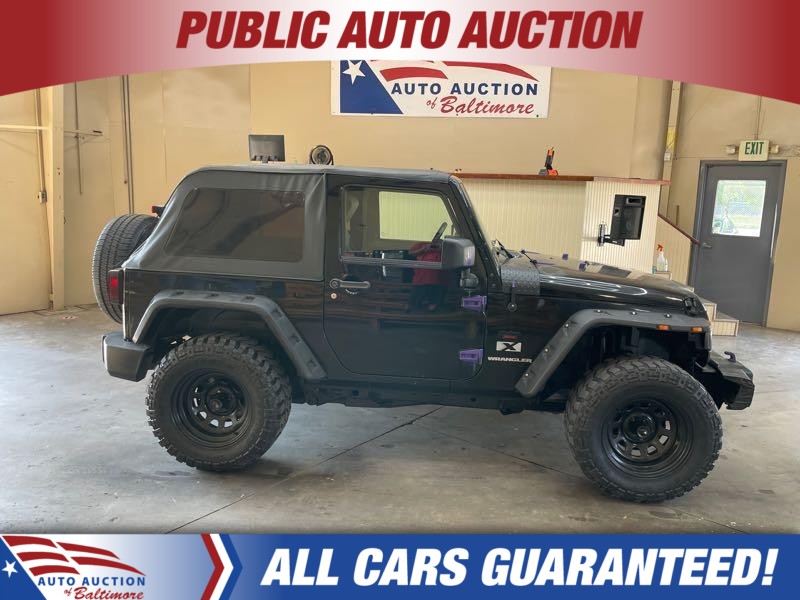 Black (BLK) 2009 Jeep Wrangler SUV / Crossover Four-Wheel Drive Manual
